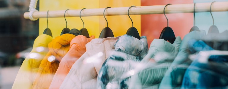 Colorful winter jackets on a store rack