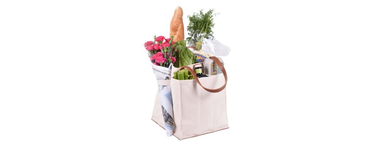 Farmer's market tote filled with grocery items