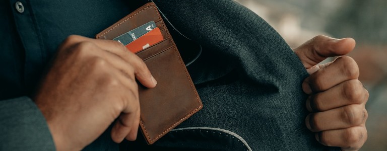 Man pocketing credit card wallet