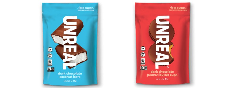 One bag of UNREAL dark chocolate coconut bars next to one bag of UNREAL dark chocolate peanut butter cups.